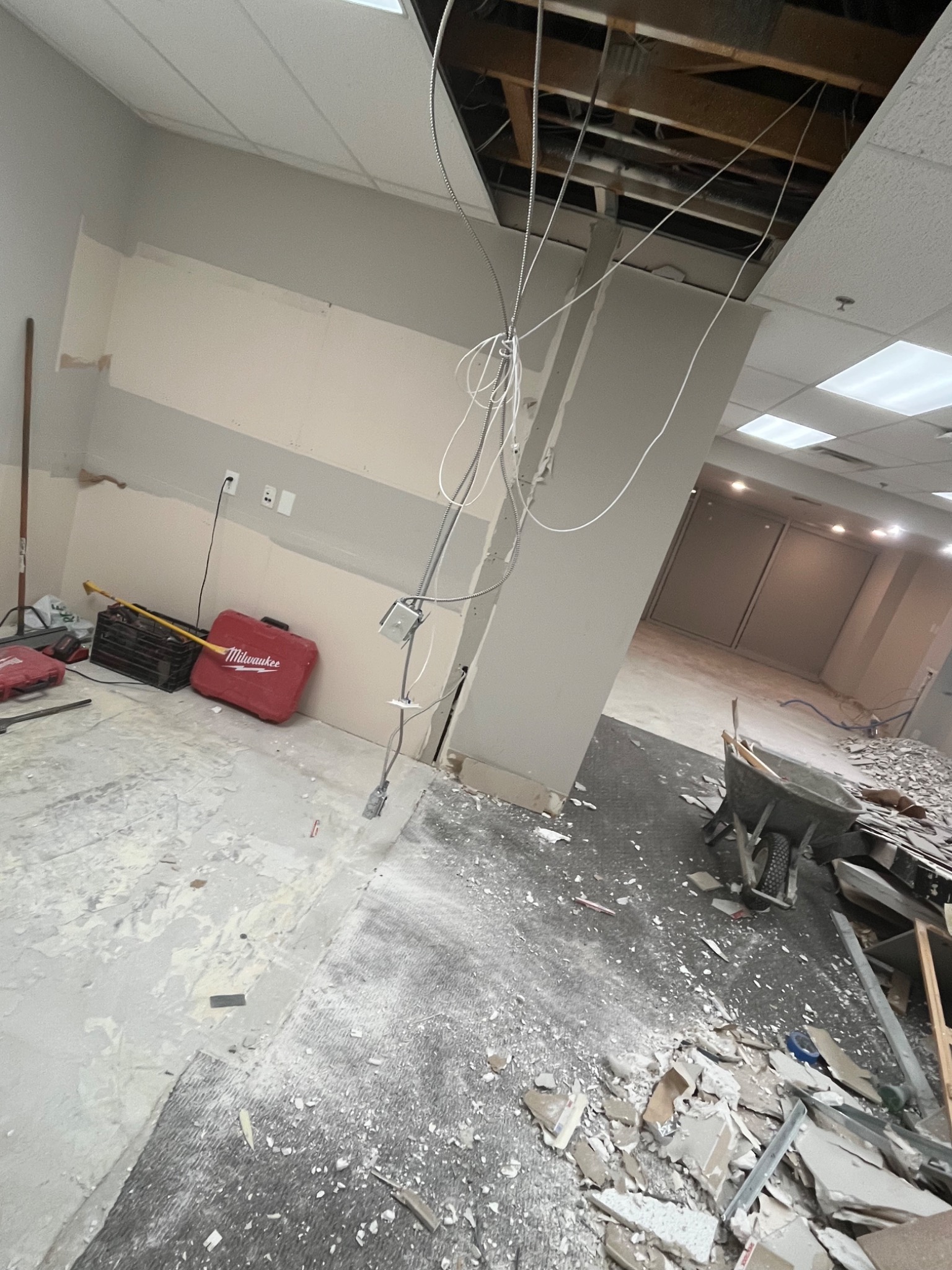 Interior renovation work area with wall and ceiling sections removed